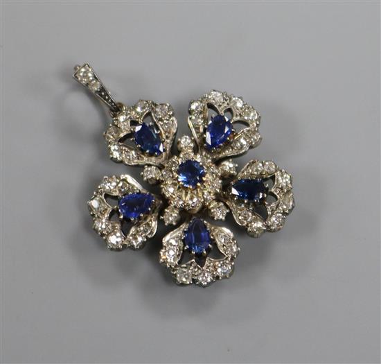 A Victorian yellow and white metal, sapphire and diamond set flower head pendant, with diamond set bale, 30mm.